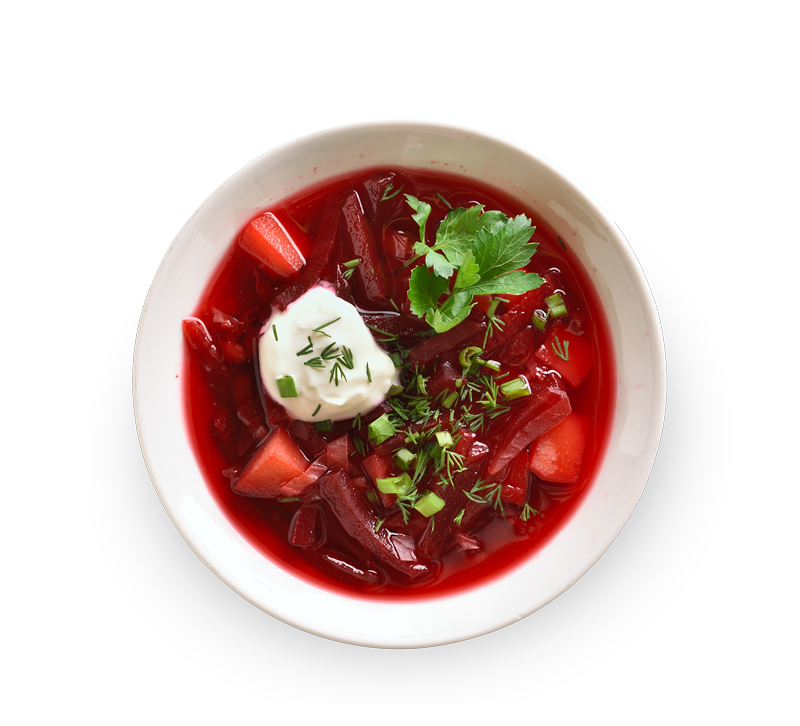 Bowl of borshch soup with greens